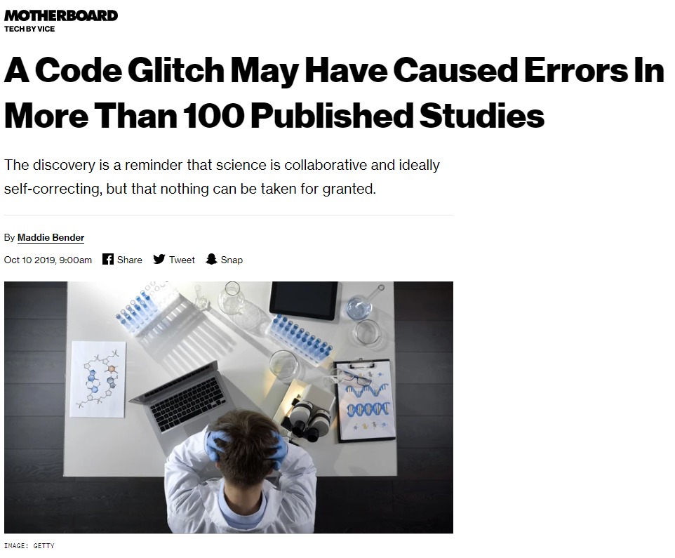 Screenshot of a scientific taking his head in his hands and sitting at a desk.